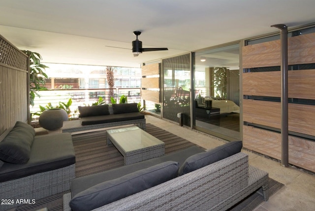 exterior space with an outdoor living space and ceiling fan