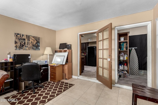 home office featuring light tile patterned flooring and french doors