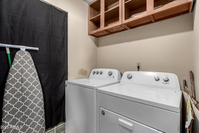 clothes washing area featuring washing machine and clothes dryer