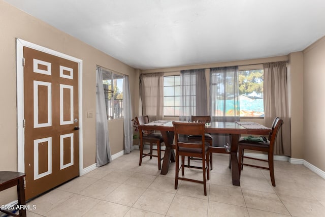 dining area featuring light tile patterned floors