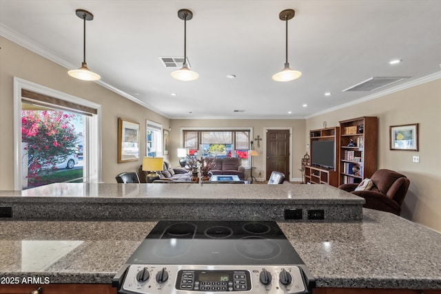 kitchen with crown molding, hanging light fixtures, and stainless steel range with electric cooktop