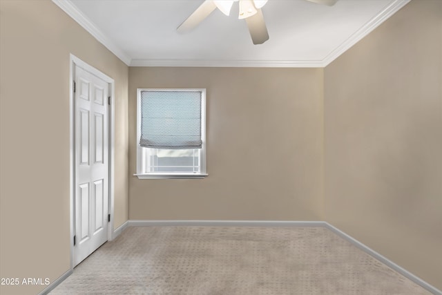 empty room with light carpet, ornamental molding, and ceiling fan