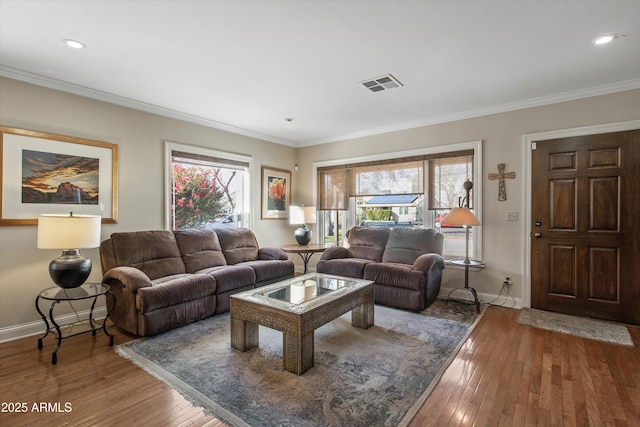 living room with ornamental molding and wood-type flooring