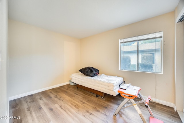 unfurnished bedroom featuring light wood-type flooring