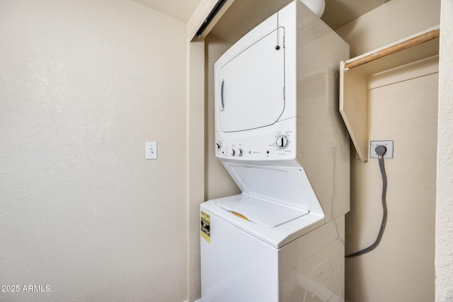 washroom with stacked washer / dryer