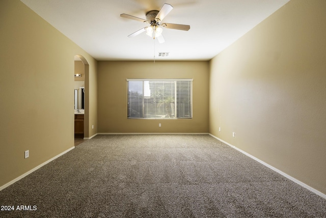 empty room featuring carpet and ceiling fan