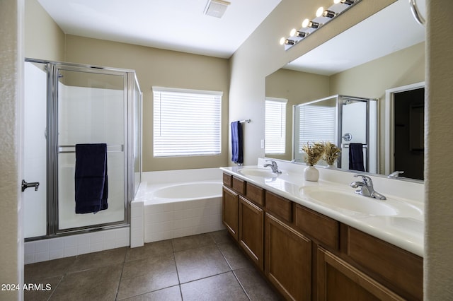 bathroom with tile patterned flooring, vanity, and independent shower and bath