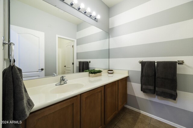 bathroom with tile patterned floors and vanity