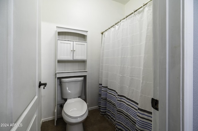 bathroom featuring tile patterned flooring and toilet