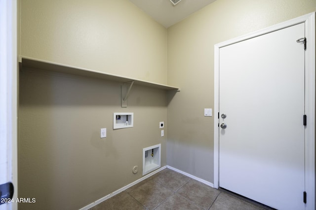 washroom with hookup for a gas dryer, tile patterned flooring, washer hookup, and hookup for an electric dryer