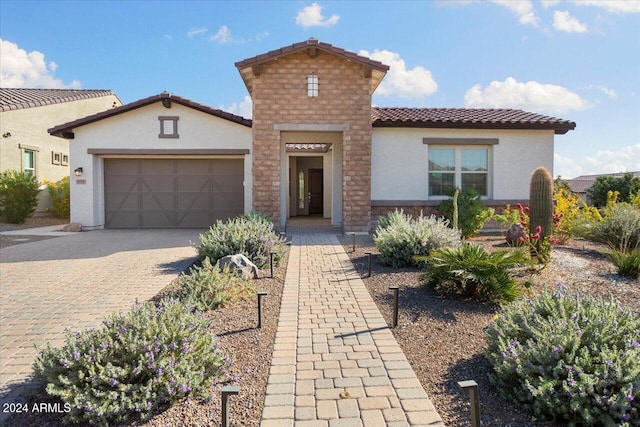 mediterranean / spanish-style house featuring a garage