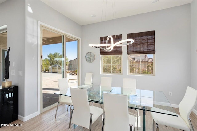 dining area featuring hardwood / wood-style flooring and wine cooler