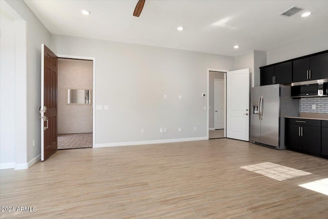 kitchen with ceiling fan, stainless steel appliances, and light wood-type flooring