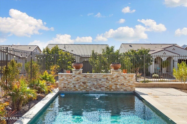 view of pool with pool water feature