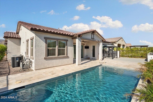 back of property with a gazebo, central AC, ceiling fan, and a patio