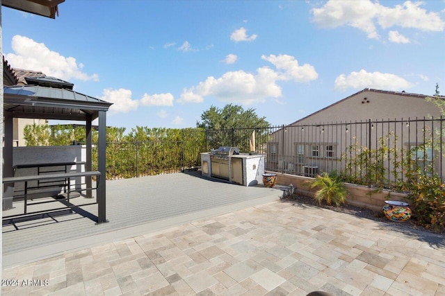 view of patio / terrace featuring a gazebo and area for grilling