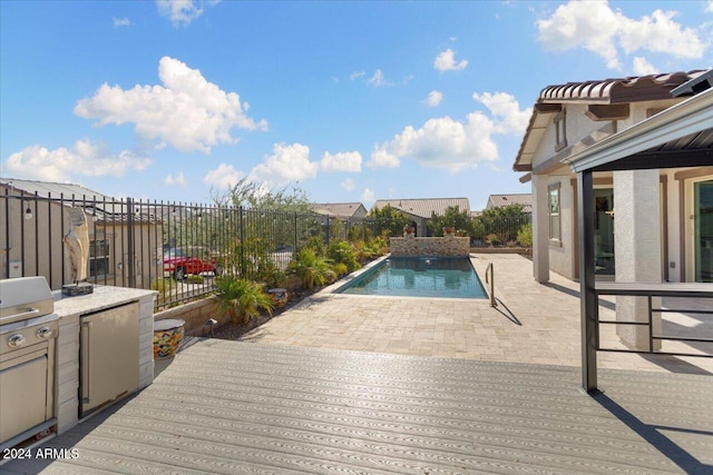 view of swimming pool with a patio