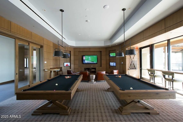 rec room with dark carpet, pool table, a tray ceiling, and french doors