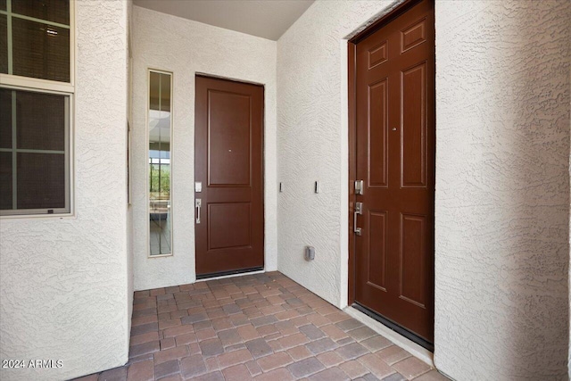 doorway to property with a porch