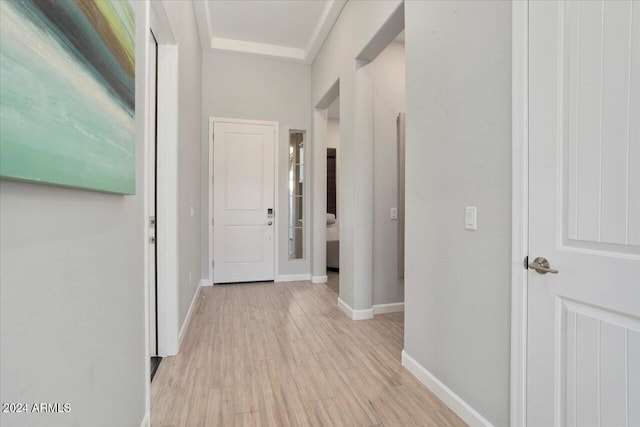 corridor with light hardwood / wood-style floors