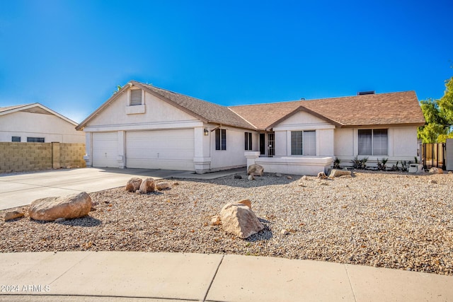 ranch-style home with a garage