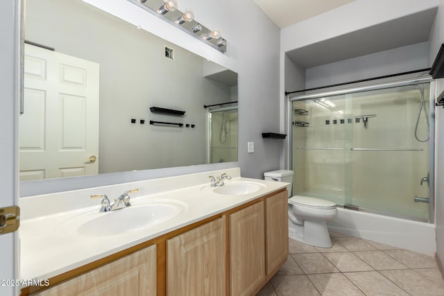 bathroom featuring tile patterned flooring, visible vents, a sink, and toilet