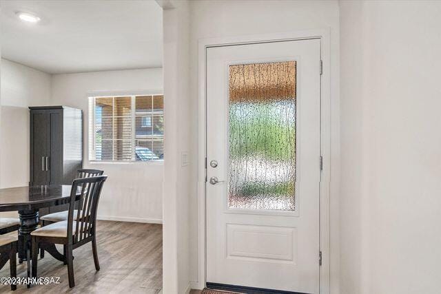 doorway to outside with hardwood / wood-style flooring