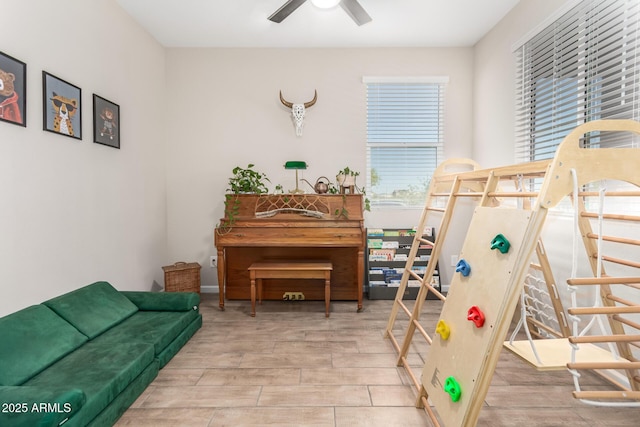 interior space with ceiling fan and wood finished floors