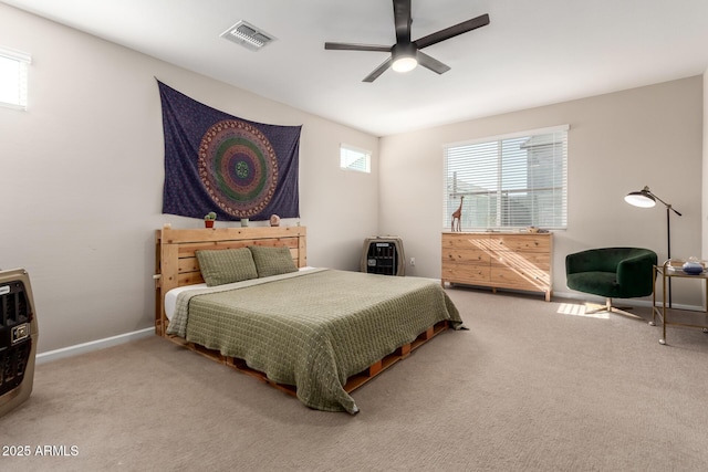 bedroom with baseboards, ceiling fan, carpet flooring, and visible vents