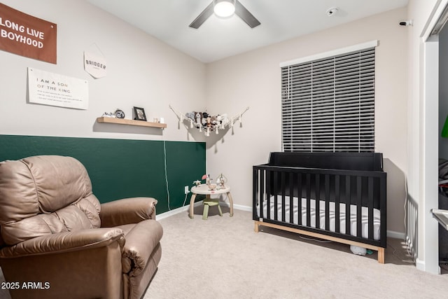 bedroom with baseboards, a ceiling fan, and carpet