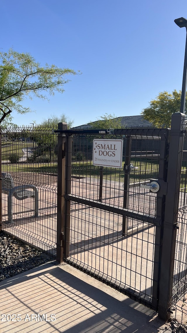 view of gate featuring fence