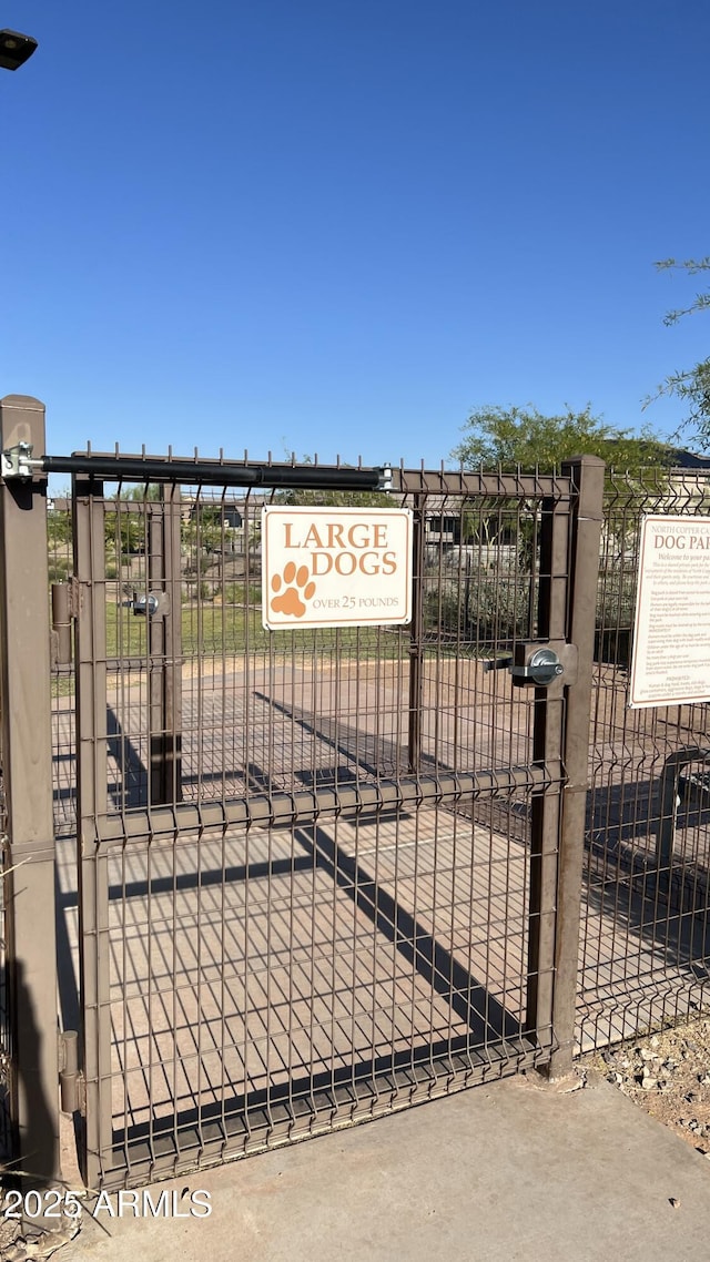 view of gate featuring fence