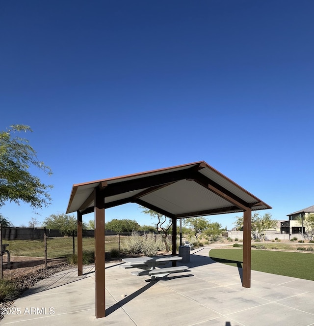 surrounding community featuring a patio area and fence