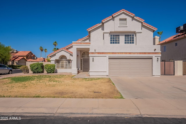 16609 S 41st St, Phoenix, AZ 85048 - view of front of house with an attached garage, concrete driveway, stucco siding, and a tiled roof