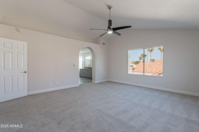 16609 S 41st St, Phoenix, AZ 85048 - empty room featuring arched walkways, ceiling fan, lofted ceiling, carpet flooring, and a smoke detector