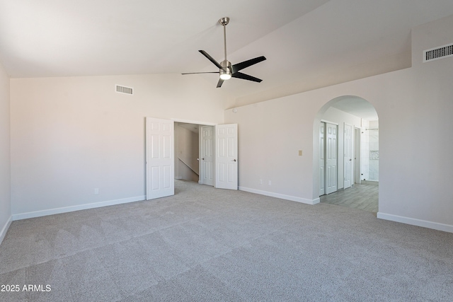 16609 S 41st St, Phoenix, AZ 85048 - spare room with light colored carpet, ceiling fan, arched walkways, and high vaulted ceiling