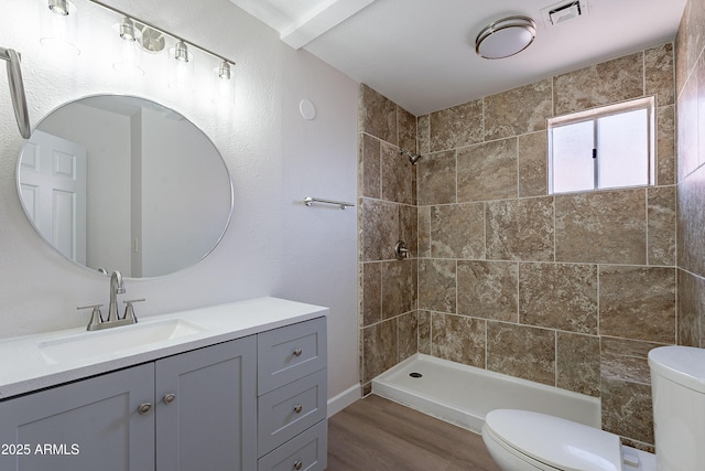 16609 S 41st St, Phoenix, AZ 85048 - bathroom with a tile shower, vanity, and wood finished floors