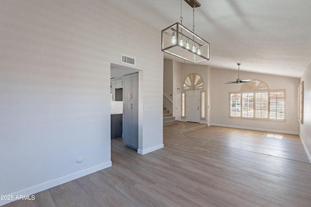 16609 S 41st St, Phoenix, AZ 85048 - unfurnished living room featuring stairway, lofted ceiling, light wood-style floors, and a ceiling fan