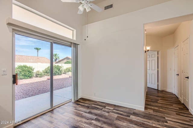 unfurnished room with dark wood-type flooring and ceiling fan