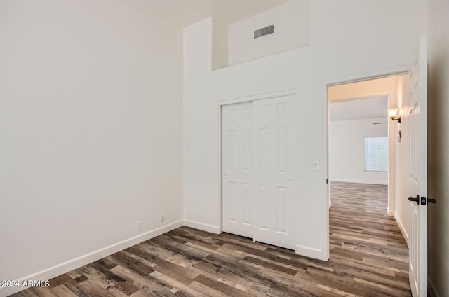 spare room featuring dark hardwood / wood-style flooring