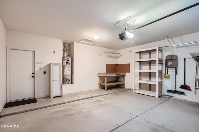 garage featuring a garage door opener and gas water heater