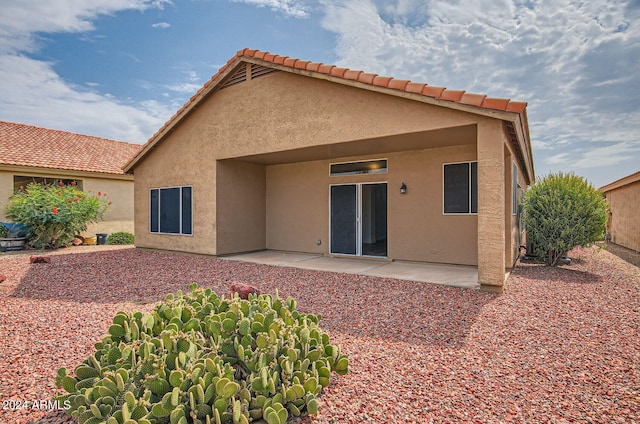 back of house with a patio area