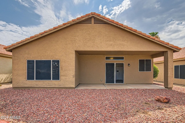 rear view of house with a patio