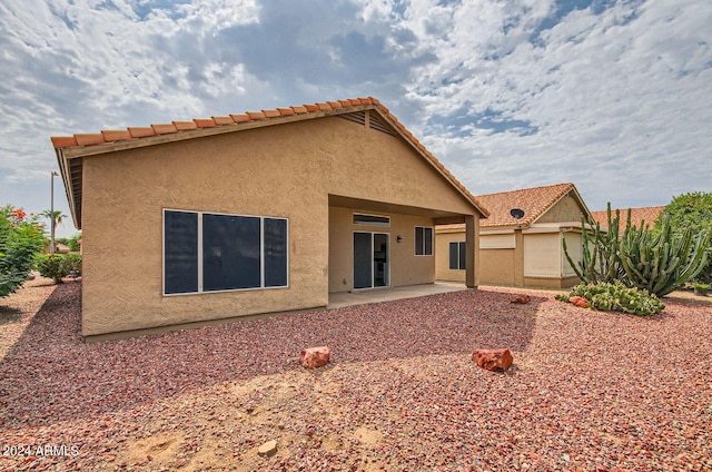 back of property featuring a patio