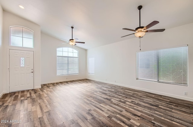 foyer featuring vaulted ceiling, ceiling fan, and dark hardwood / wood-style flooring