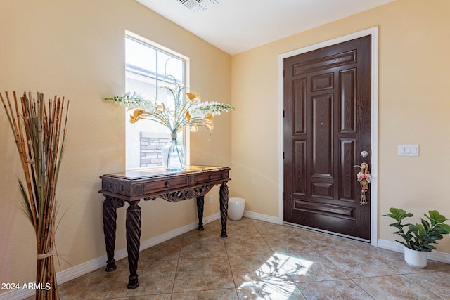 foyer featuring light tile patterned floors