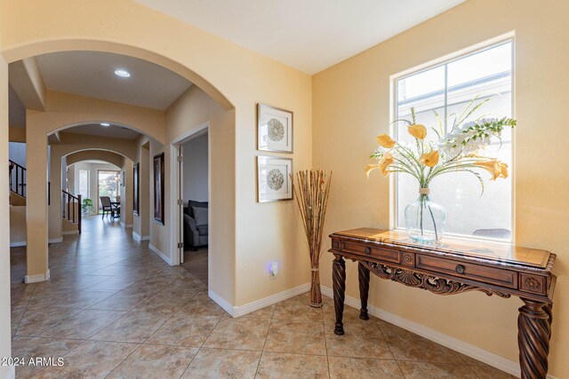 hallway with light tile patterned floors