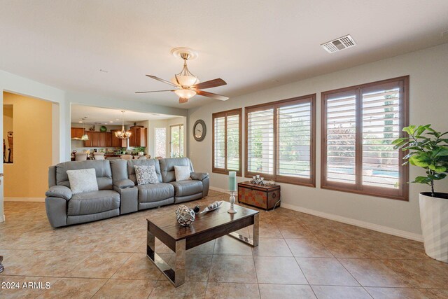 kitchen with a kitchen breakfast bar, dishwasher, pendant lighting, a kitchen island, and gas cooktop