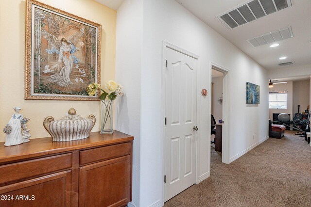 kitchen with appliances with stainless steel finishes, hanging light fixtures, a notable chandelier, light stone counters, and a kitchen island