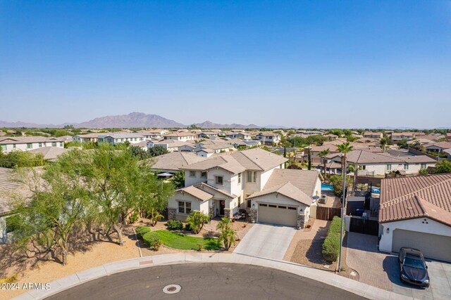 birds eye view of property with a mountain view